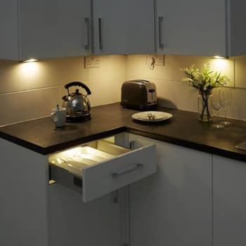 recessed lights over a kitchen counter