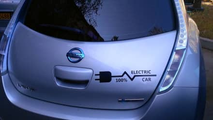 A silver Nissan electric car