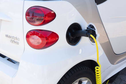 an electric car plugged into a charging station